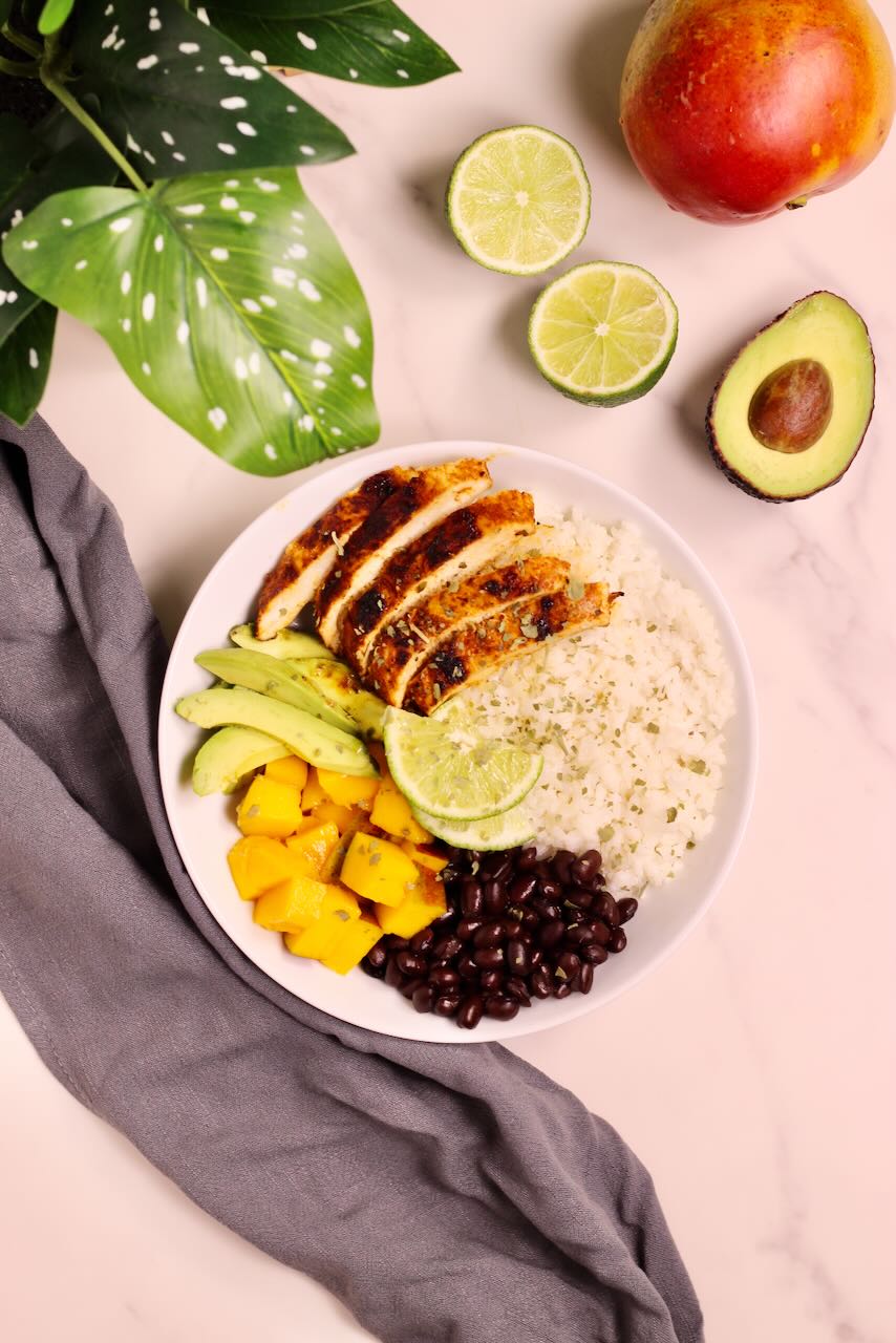 Mango Coconut Tropical Rice Bowl with avocado, lime, and mango on side
